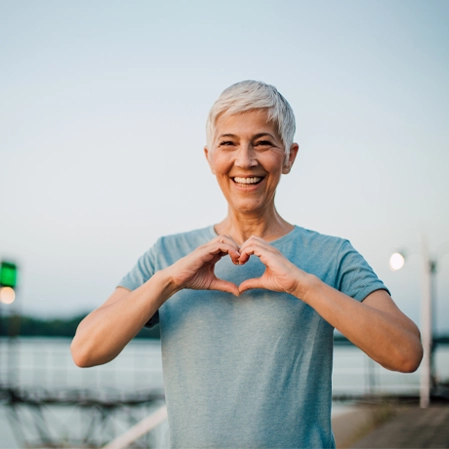 Chiropractic Frederick CO Lady Making Heart Hands