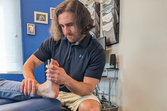 Chiropractor Frederick CO Ben DiNobile Foot Adjustment